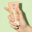 Barr-Centella-Soothing-Sun-Essence held in one hand