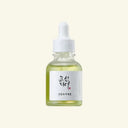 Bottle of skincare serum with a dropper on a white background