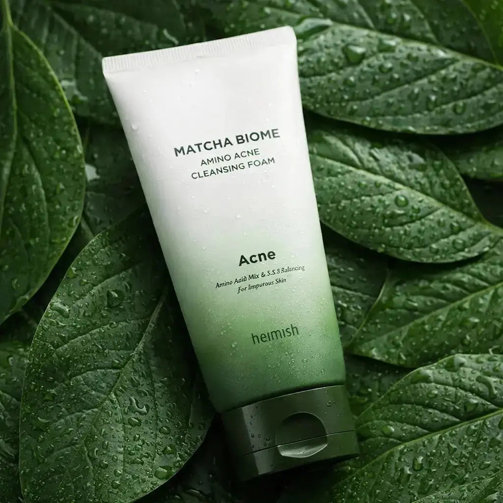 Tube of Matcha Biome cleansing foam on green leaves