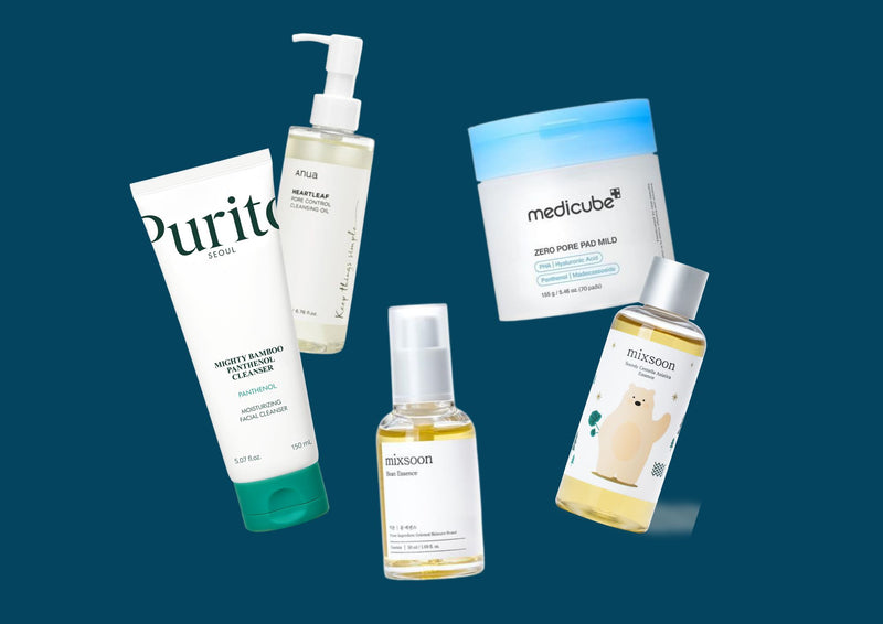 Collection of skincare products including bottles and a jar on a blue background