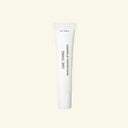 White tube of 'ONE THING' moisturizing lip essence on a beige background