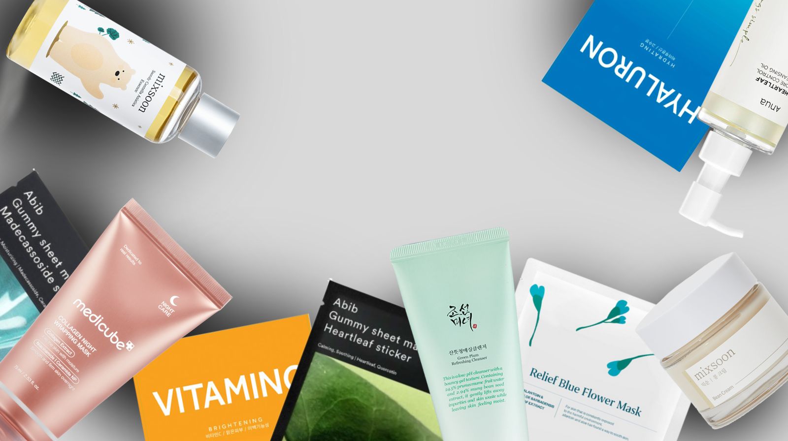 Various skincare products on a gray background