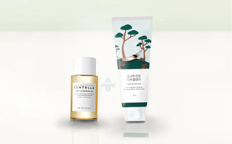 Two skincare products, a bottle and a tube, on a white background with a green tree design.