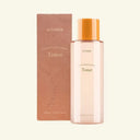 wismin toner bottle and packaging on a light beige background
